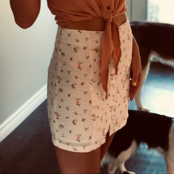 Cute white and floral mini skirt with cute buttons in front